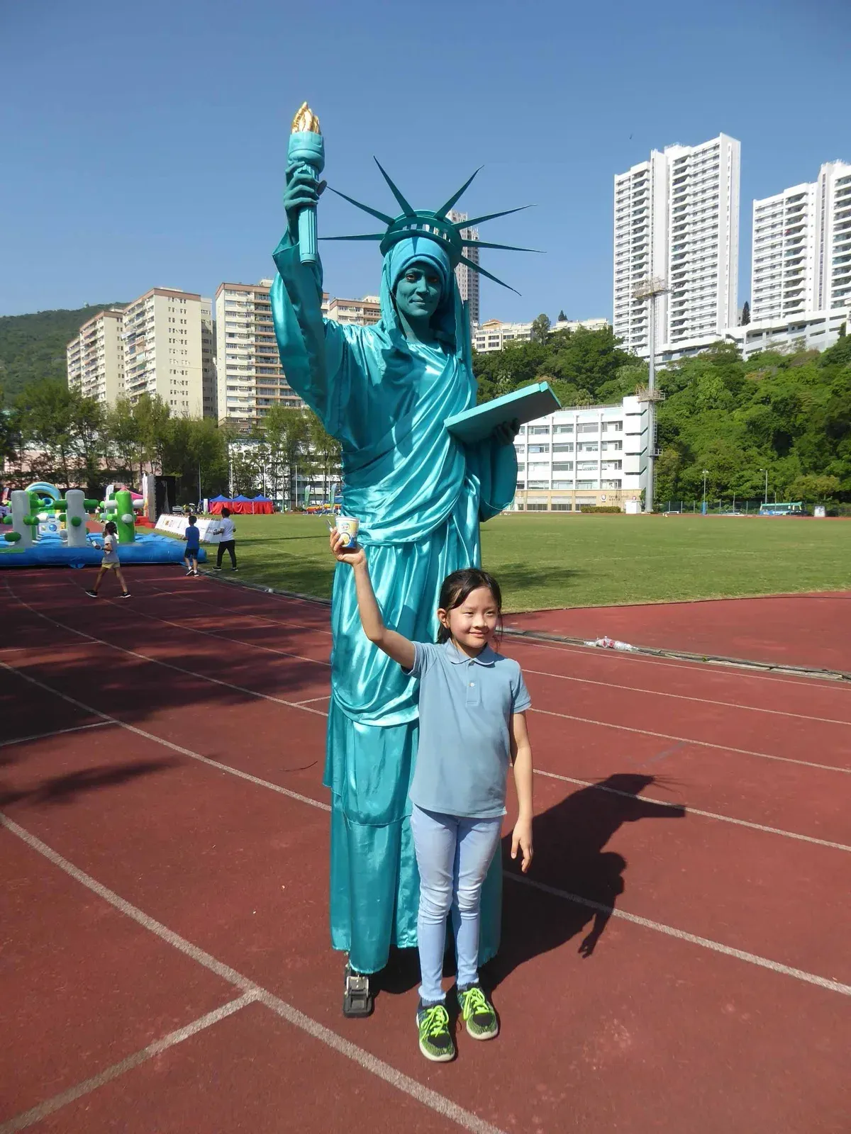 America Statue of Liberty Mime character on stilts for outdoor event in Hong Kong