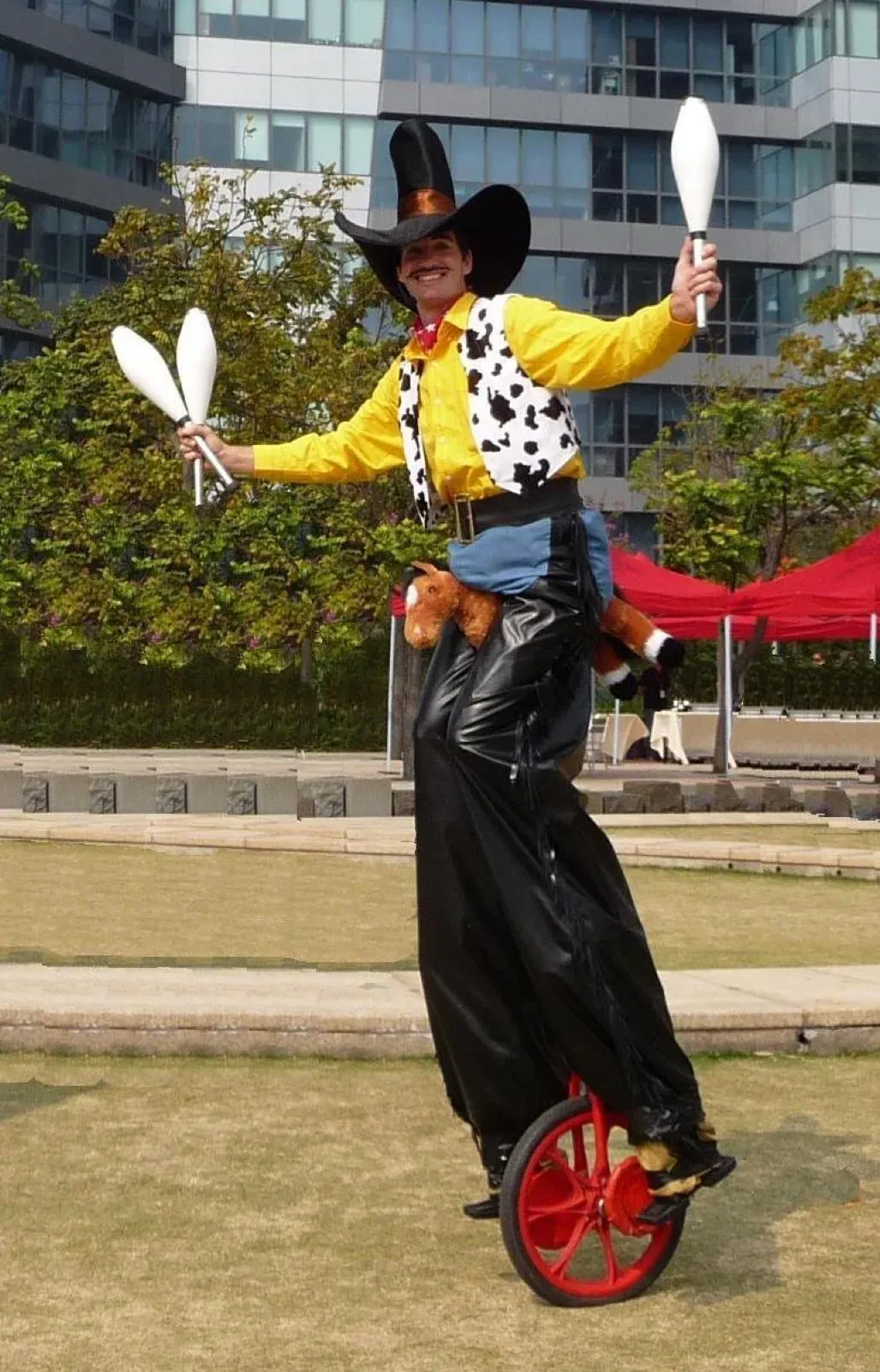 American tall cow boy stilts walker character in hong kong event
