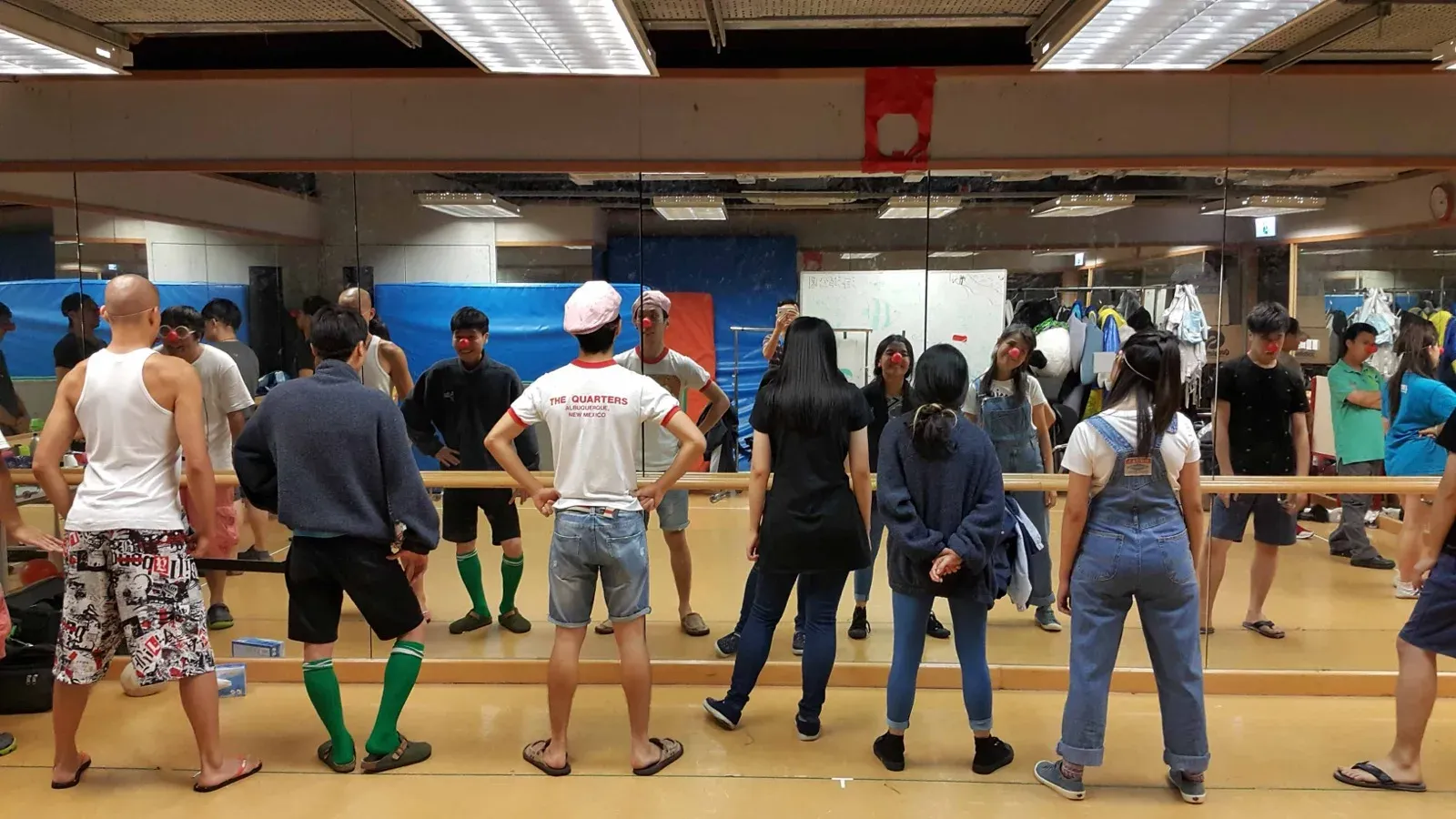 Bamboo Jam cast warming up at the ballet barre during rehearsals in Hong Kong