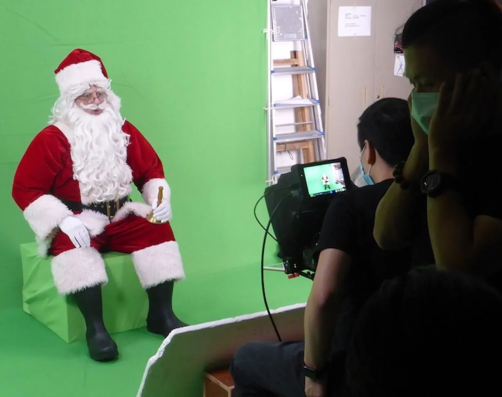 Western Santa filming a video on a green-screen set in Hong Kong