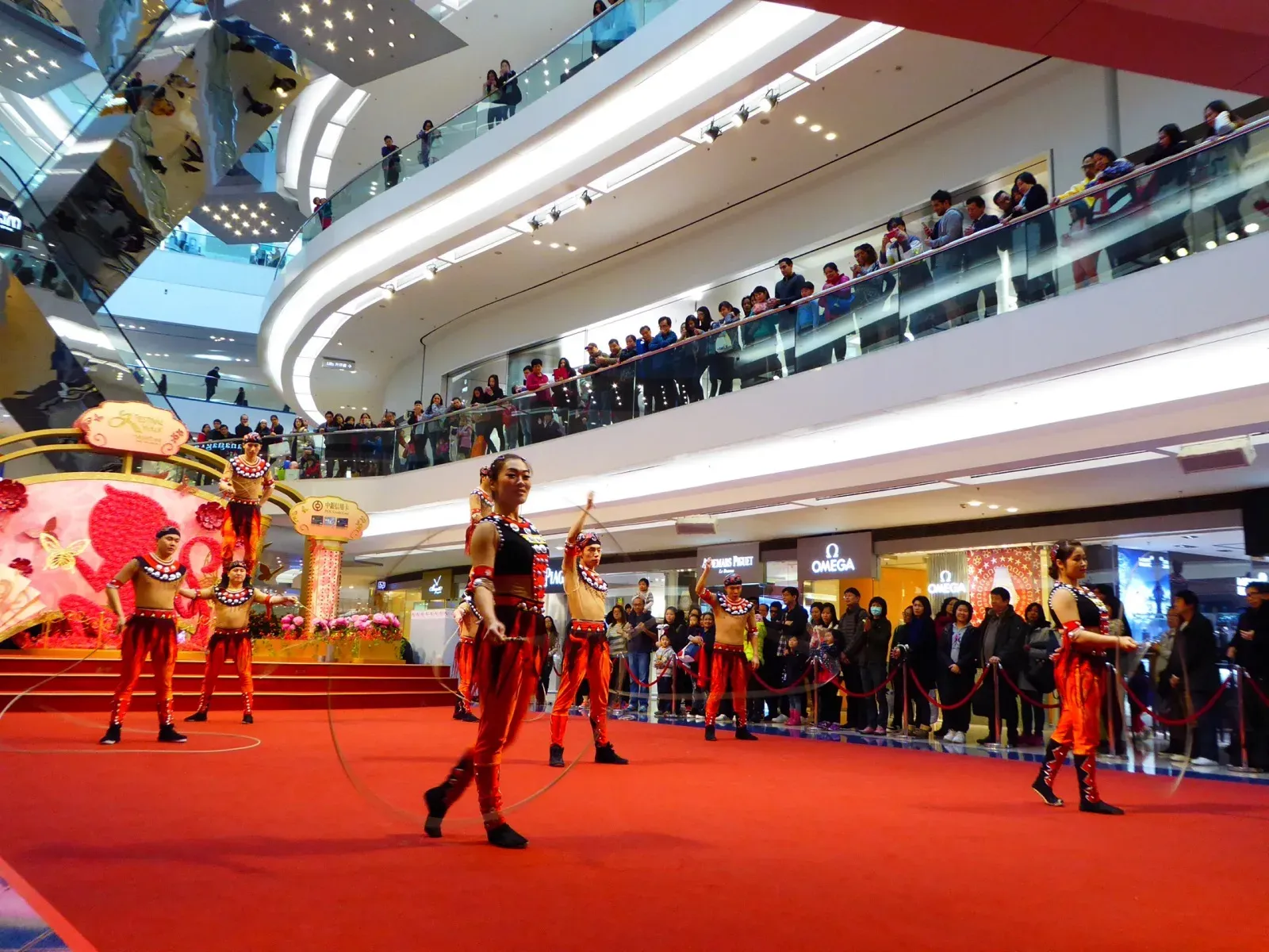 Chinese martial arts troupe performing to shoppers in the Festival Walk atrium at Chinese New Year, Hong Kong