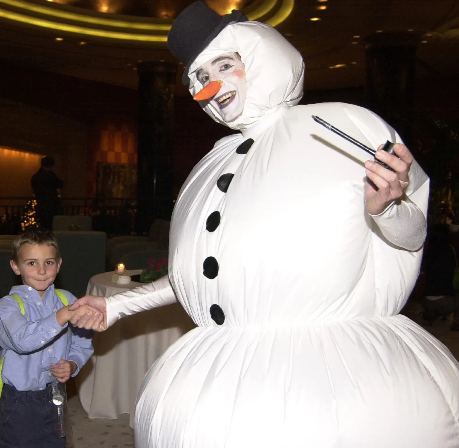 Christmas snowman in Hong Kong shake hand with children
