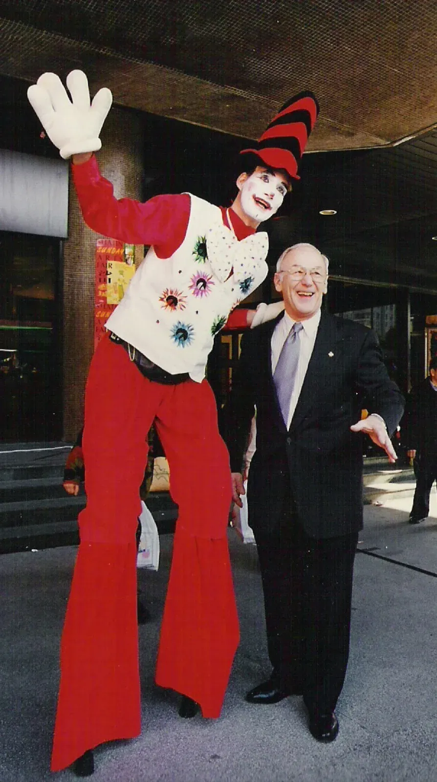 clown stilts walker in hong kong for press photo event with CEO of American company