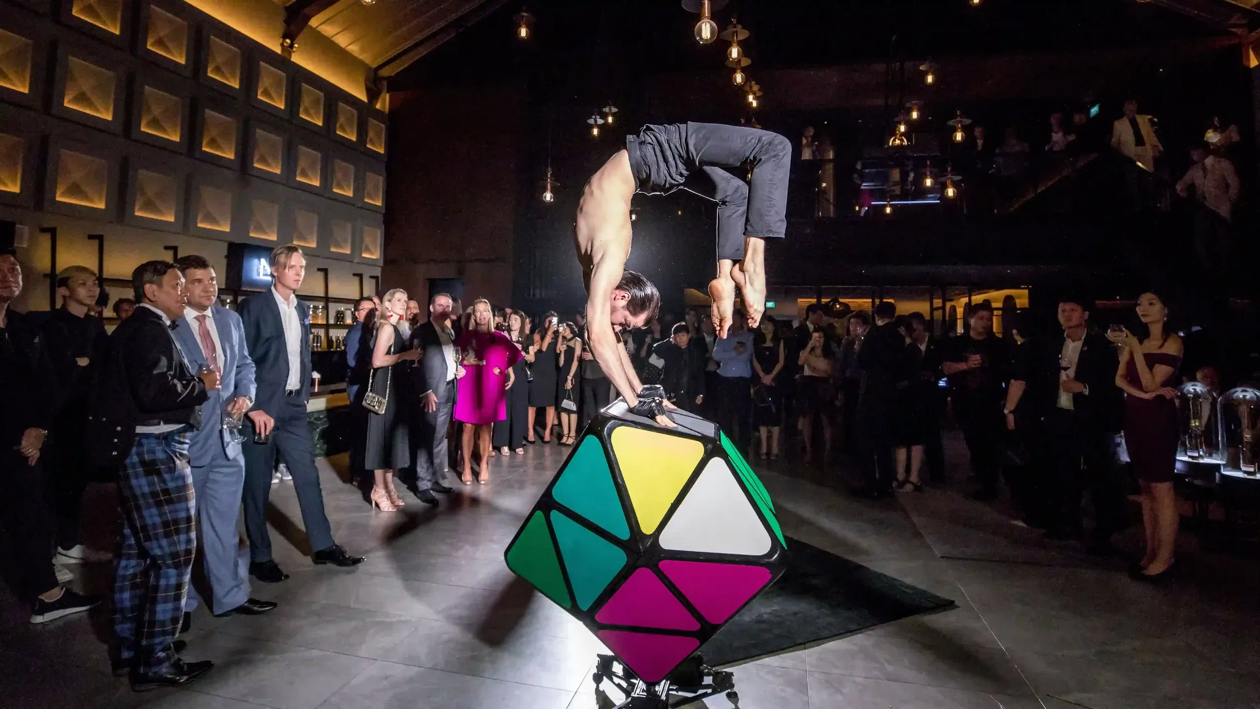 Acrobat on colourful cube for cocktails and gala dinners in Hong Kong