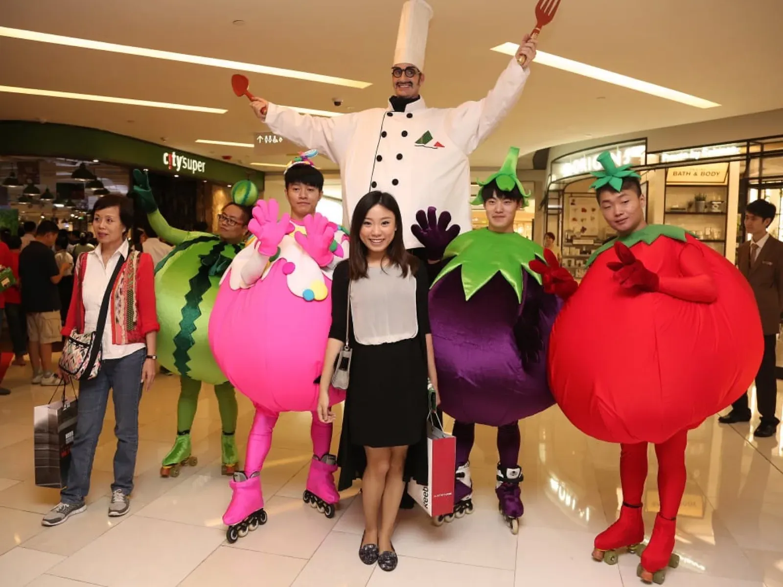 Cooking chef on stilts & vegetable fruits costumes character on roller in Shanghai event