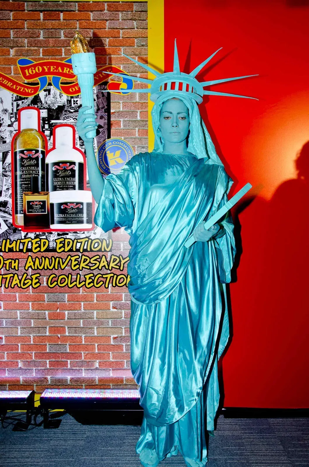 Entertainer in Hong Kong wears green American statue of liberty outfit