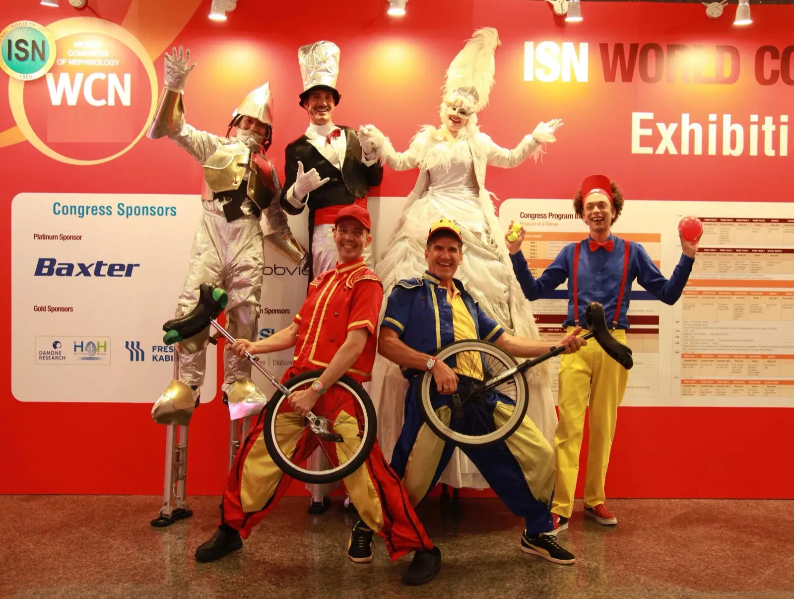 Circus performers, stilts walkers and unicyclists at the ISN World Congress of Nephrology exhibition in Hong Kong