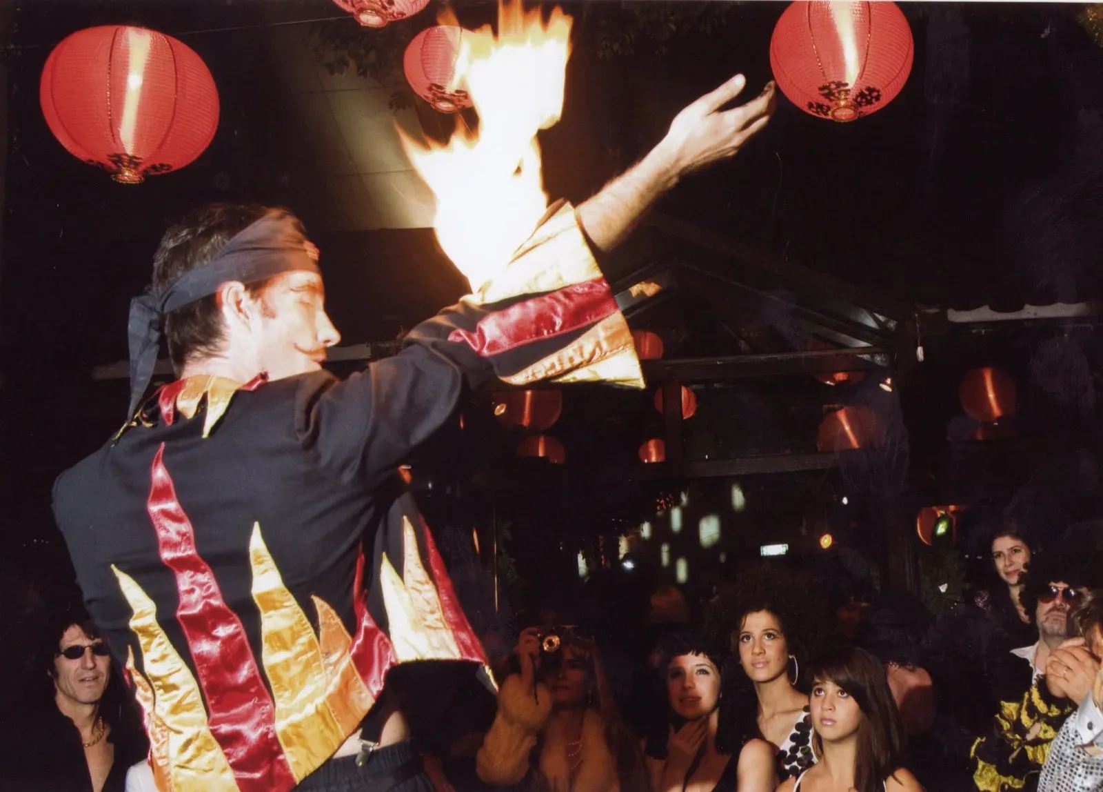 Fire clubs juggling during fire show in Hong Kong event