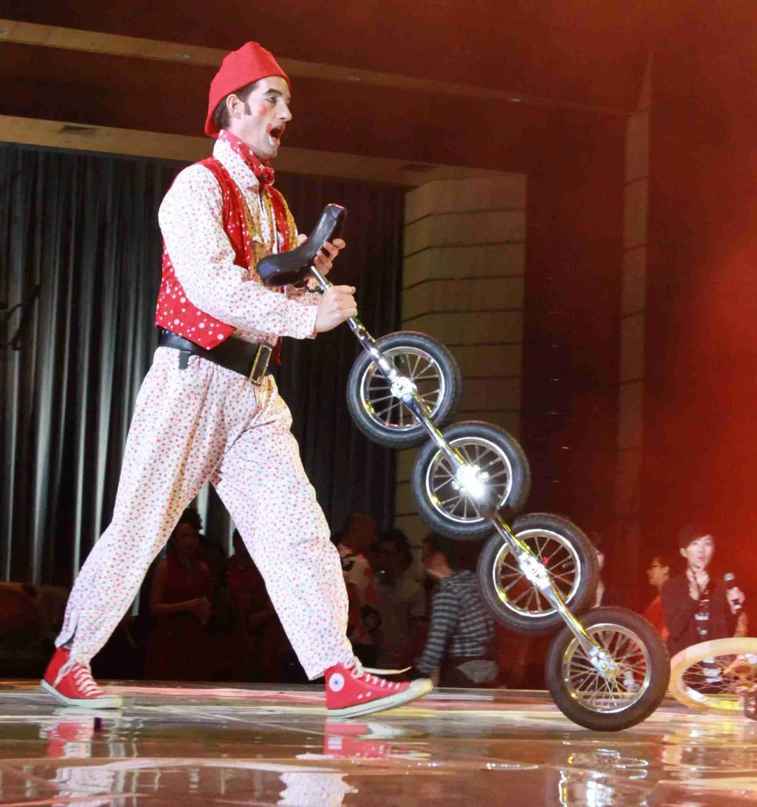 Four-wheel tall unicycle act for Hong Kong street shows
