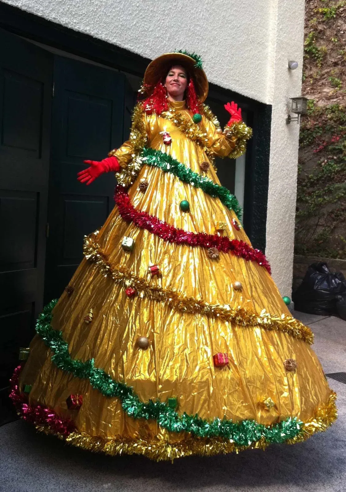 Golden Christmas tree on stilts in Hong Kong mall event