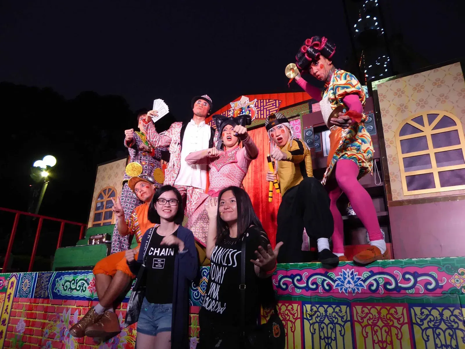 Halloween characters posing with guests at a night-time Halloween event in Hong Kong