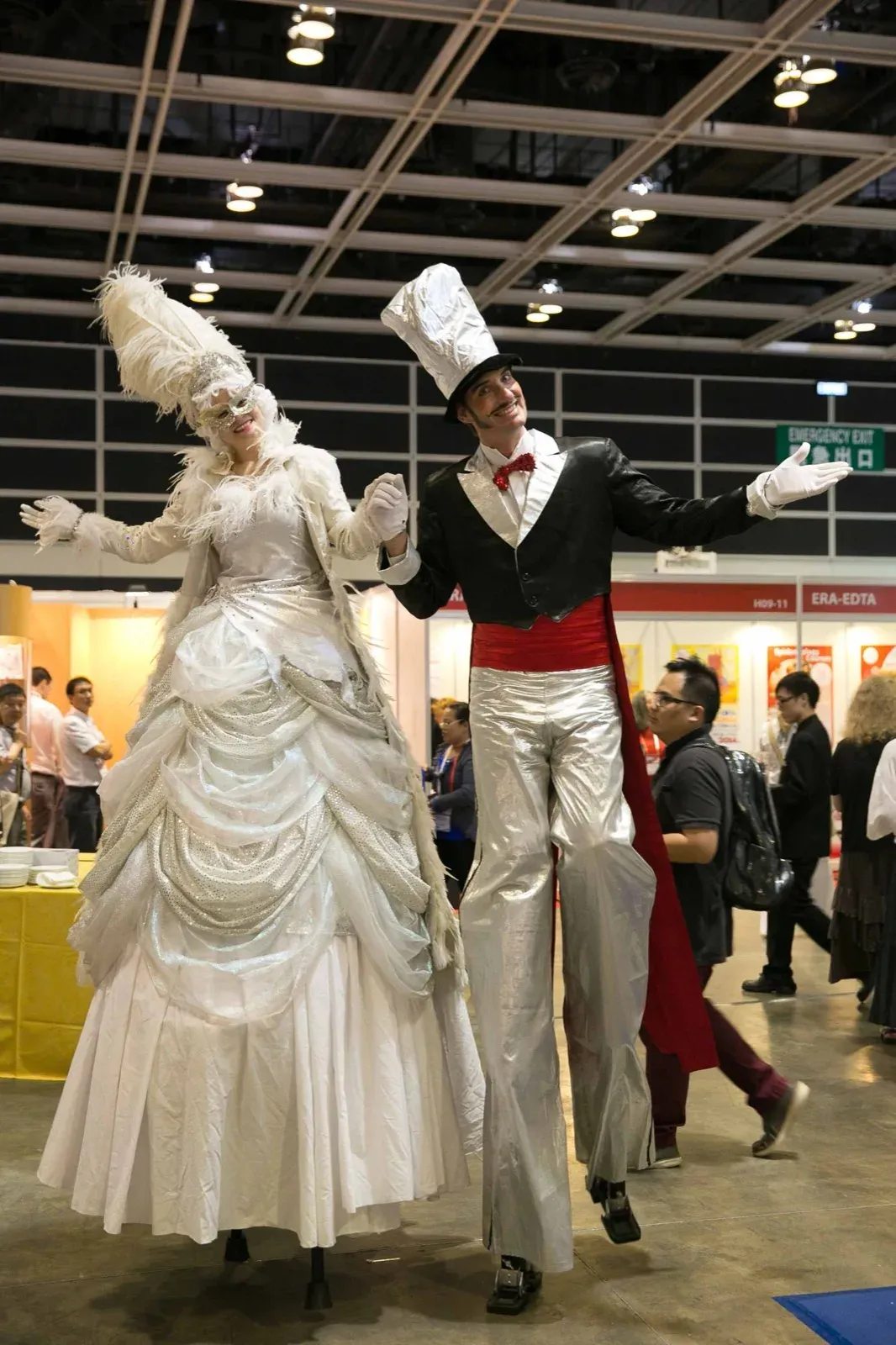 hk convention center stilts walkers with white lady & classy tuxedo roving performers
