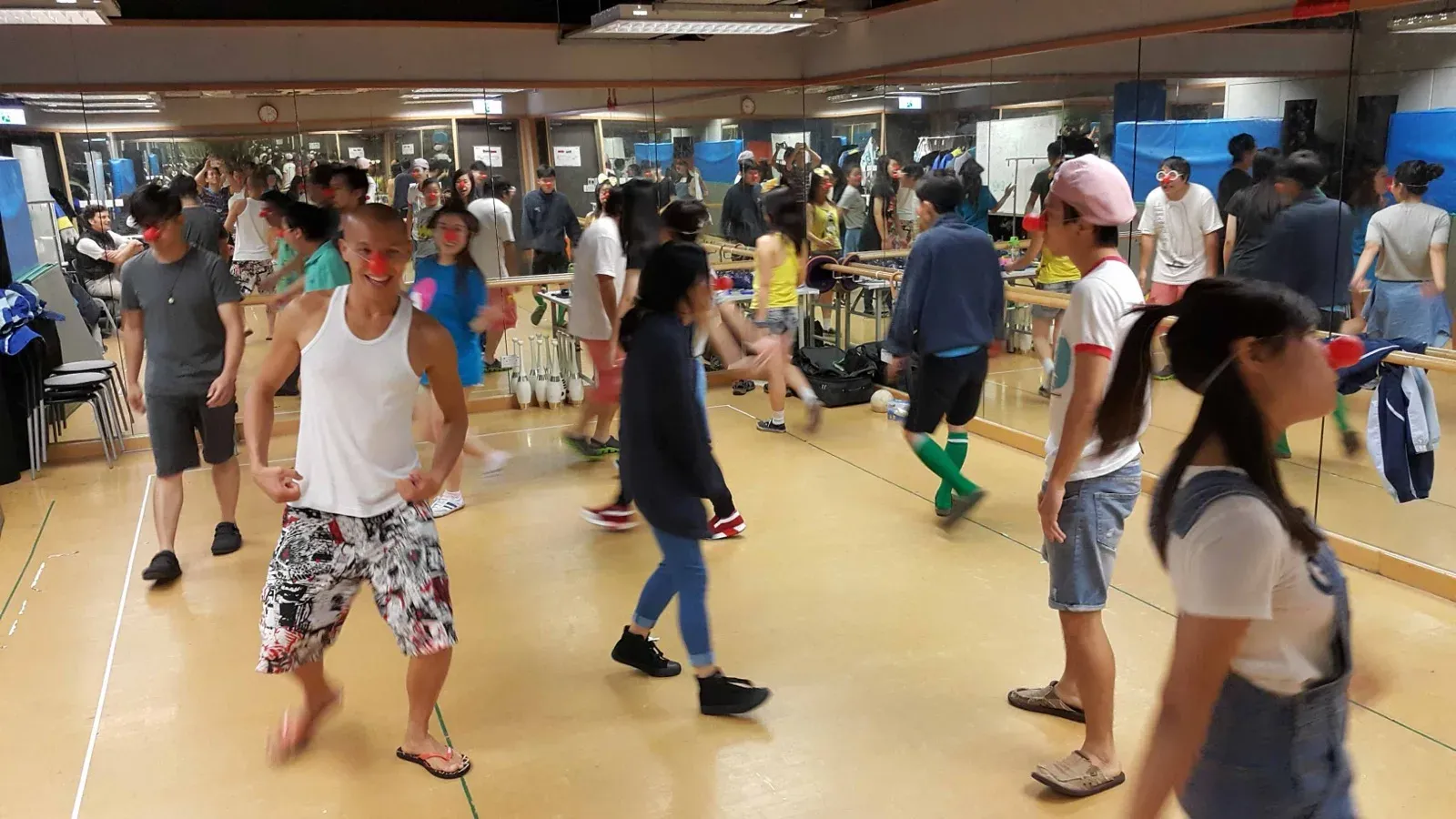 Adults practising movement in a clown training workshop in Hong Kong