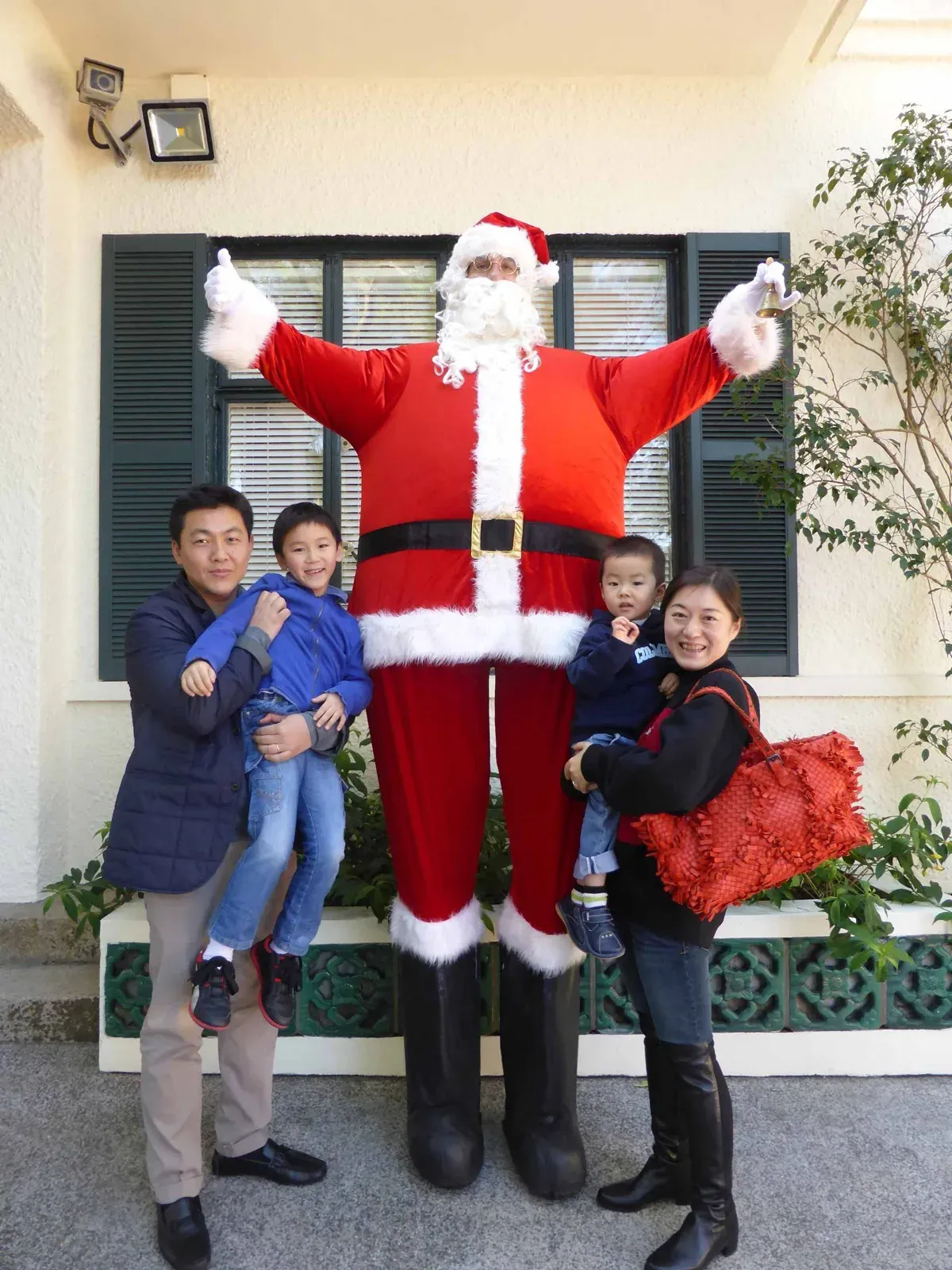 hong kong giant fat inflated Santa on stilts