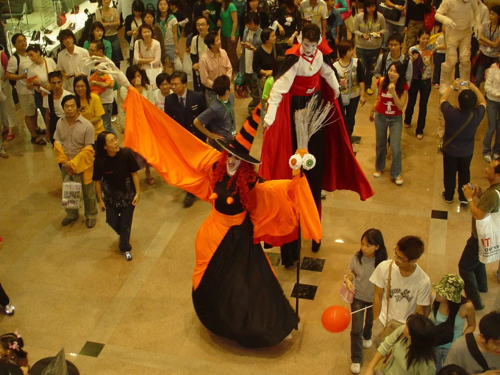 Hong Kong Halloween Witch & Vampire on stilts in mall