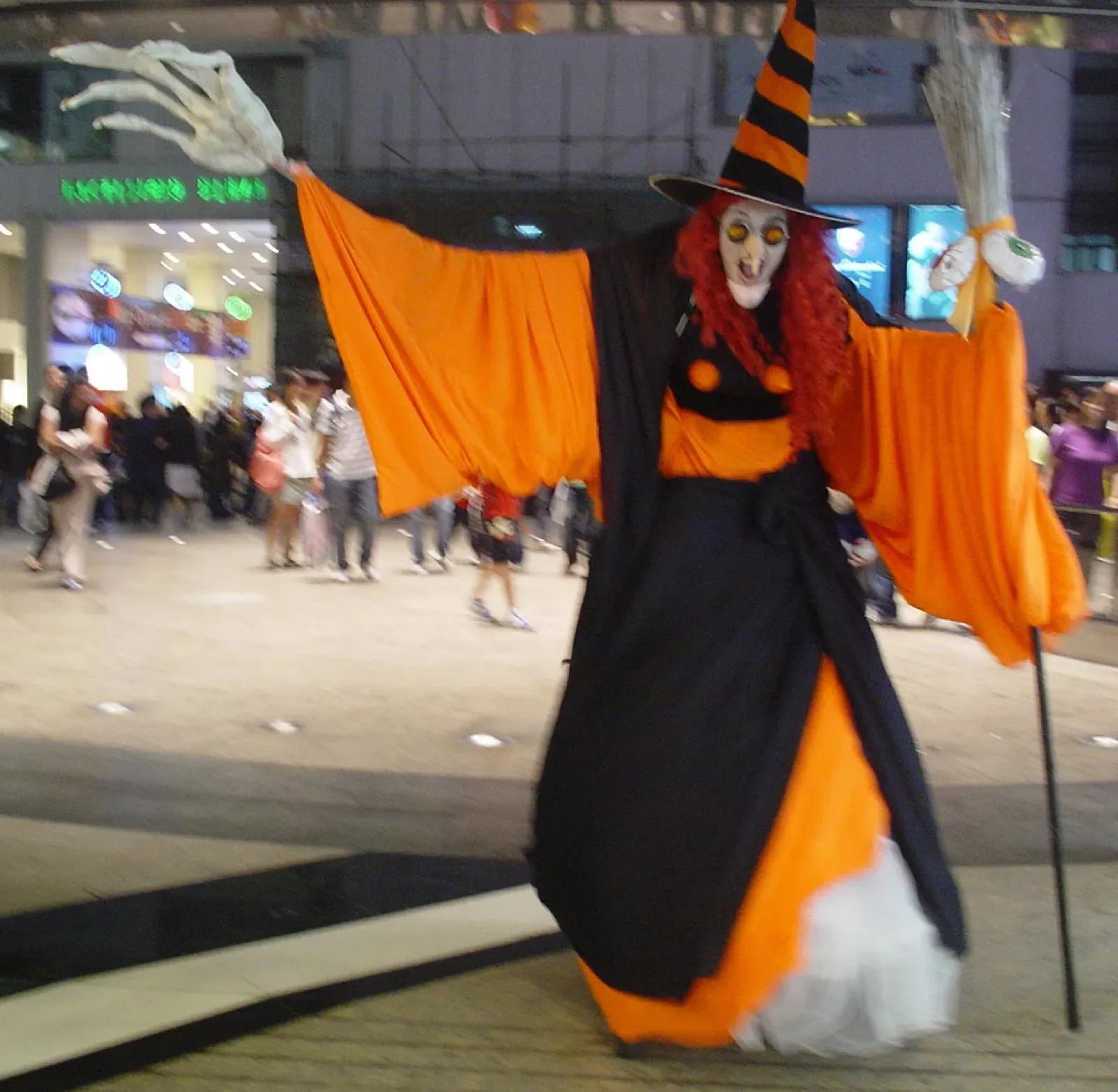 hong kong halloween witch on stilts