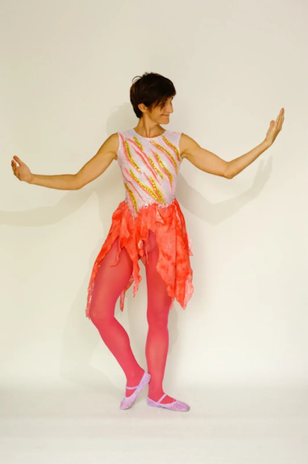 Dancer in a pink skirt and a patterned top