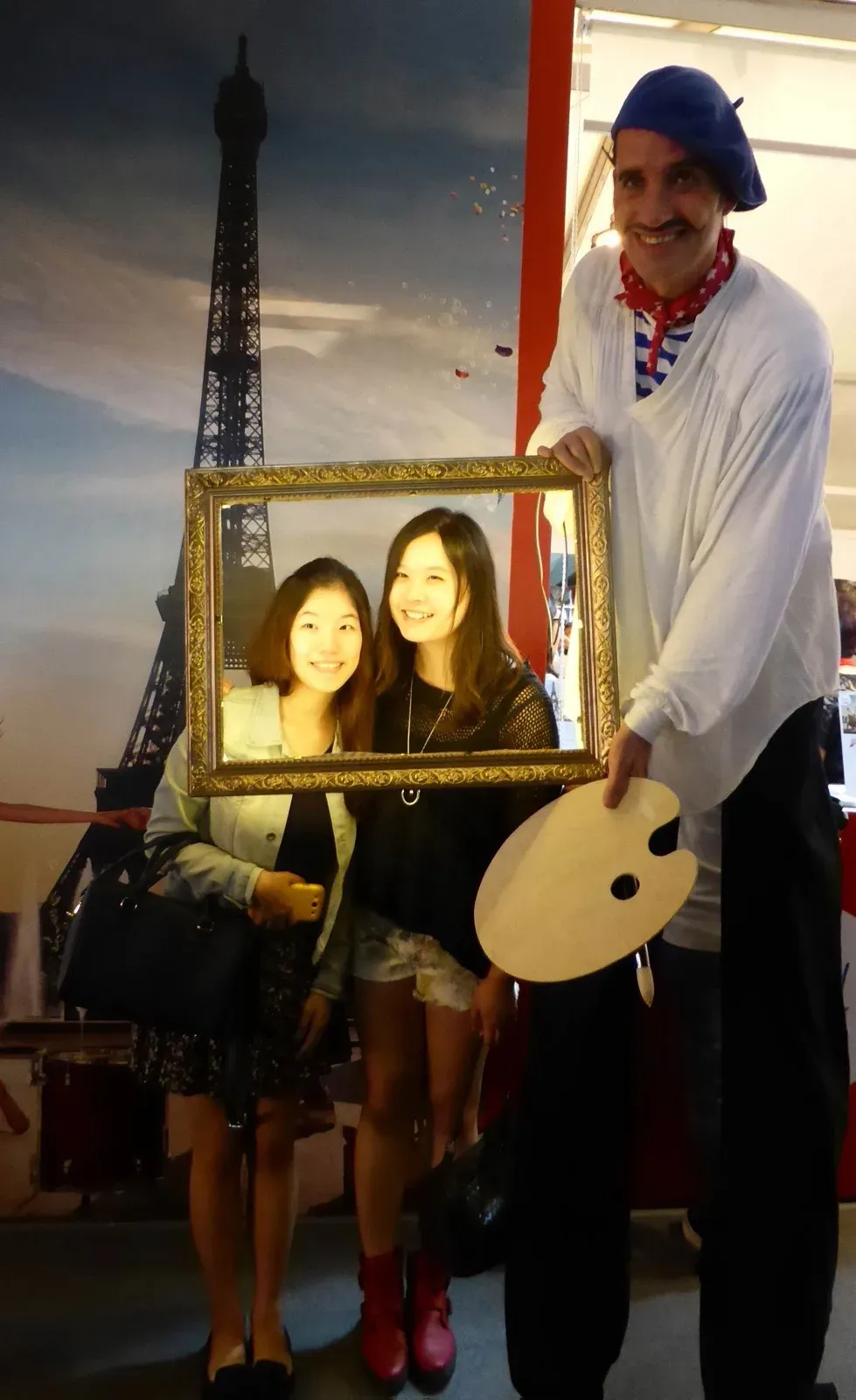 Hong Kong LED Frame picture hold by French painter on stilts