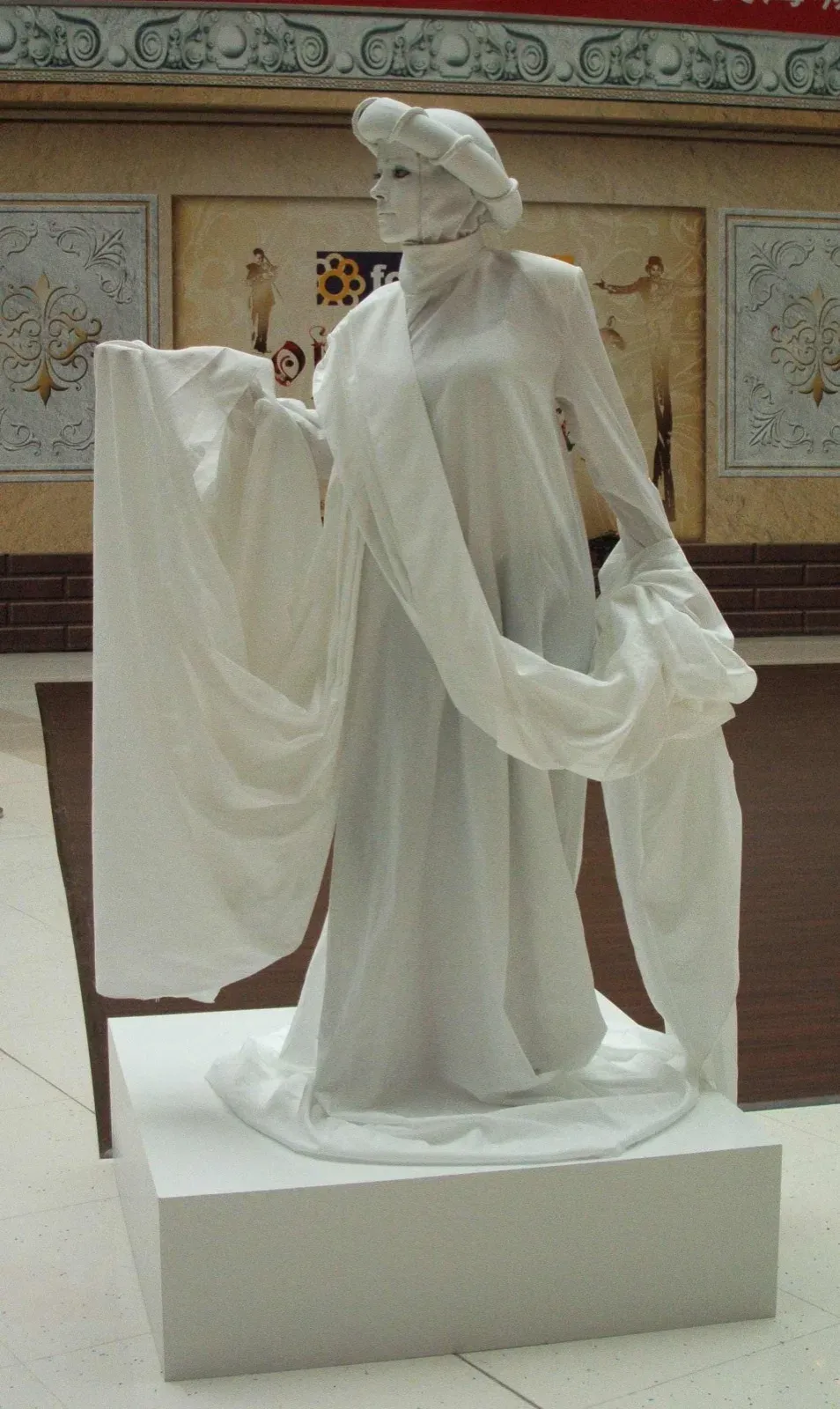 hong kong living statue mime in white dress & Italian costume