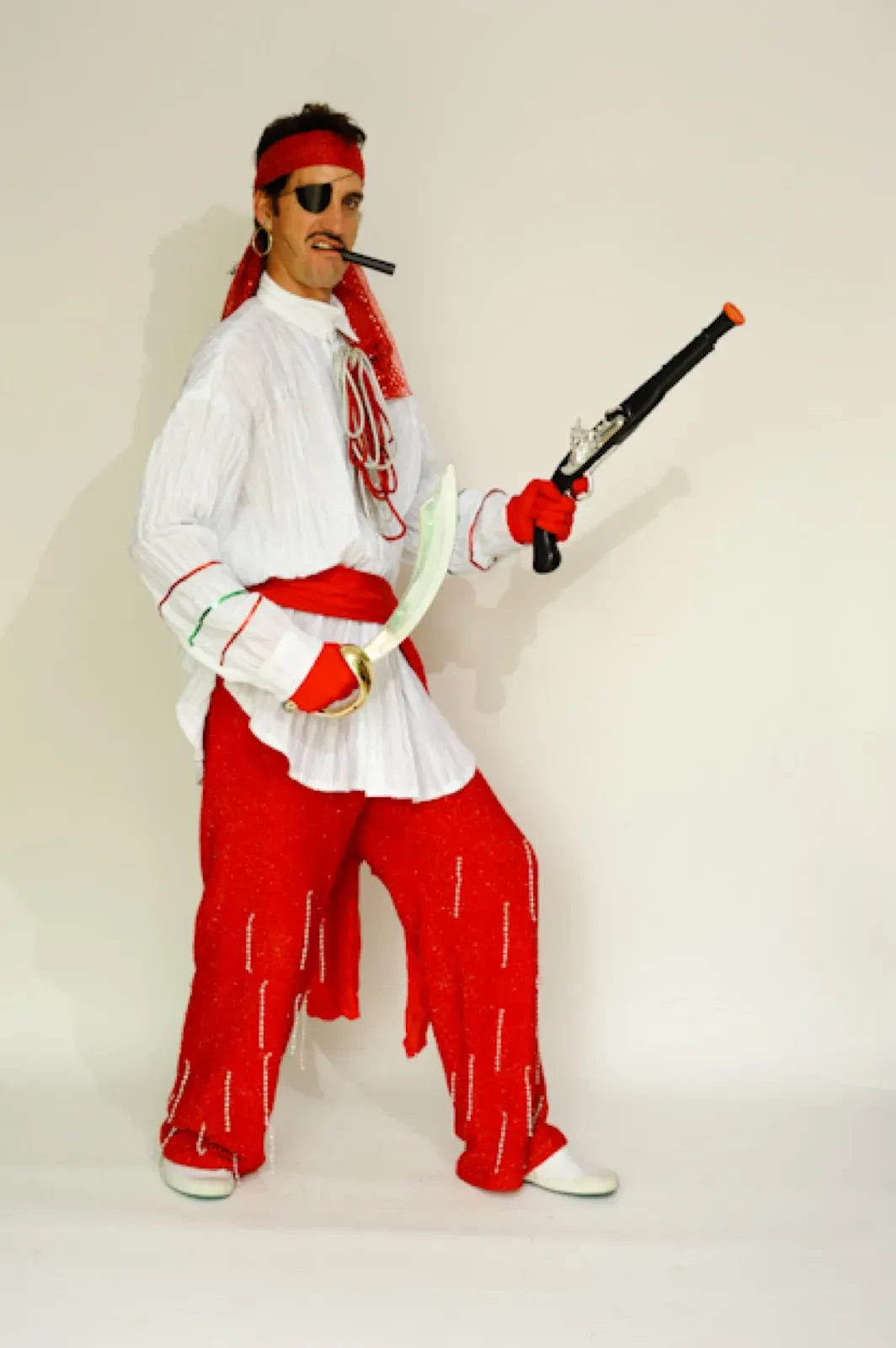 Pirate in red and white with a cigar and a pistol
