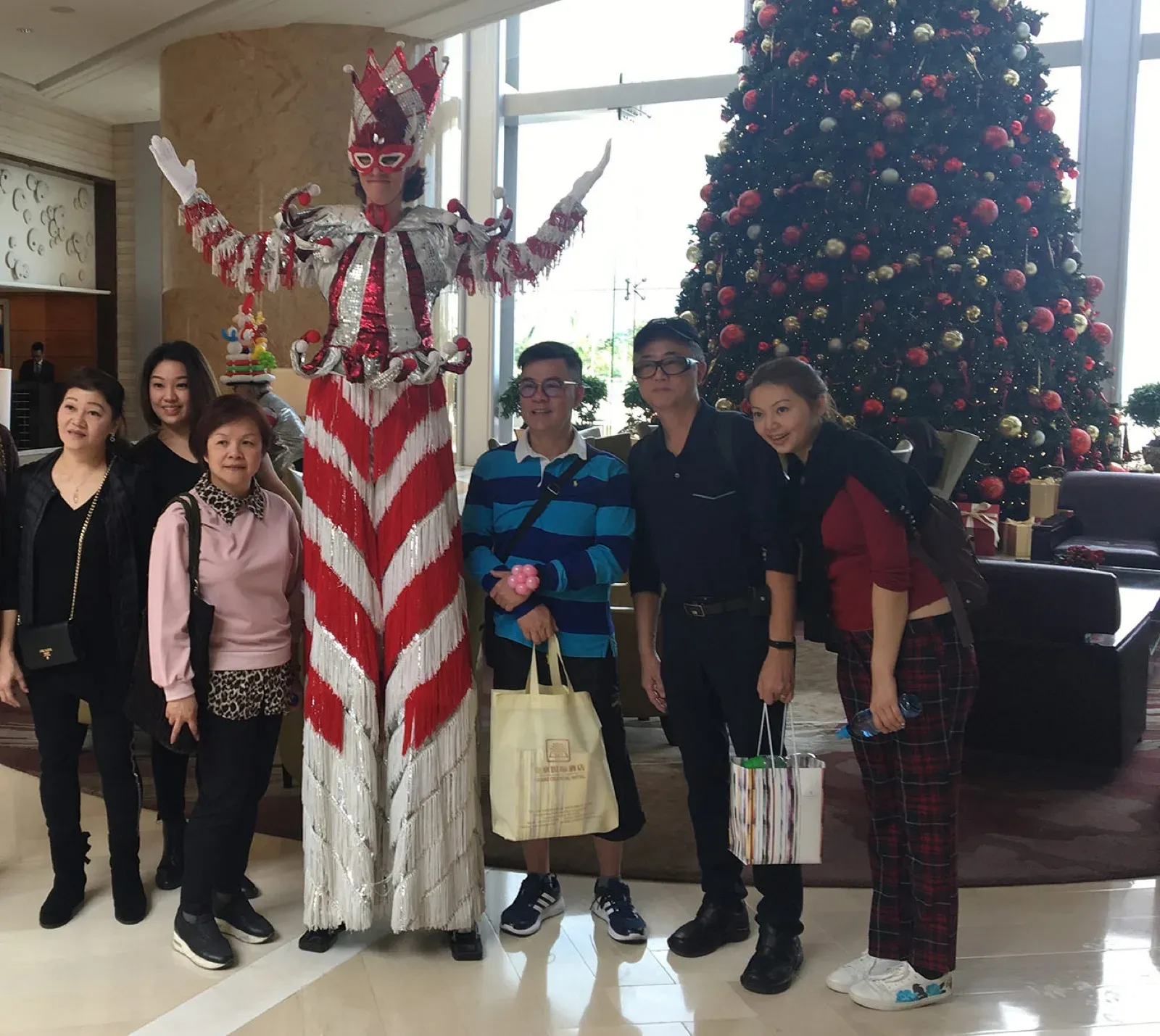 Hong Kong Red & Silver stilts walker for Christmas in Four Seasons Hong Kong