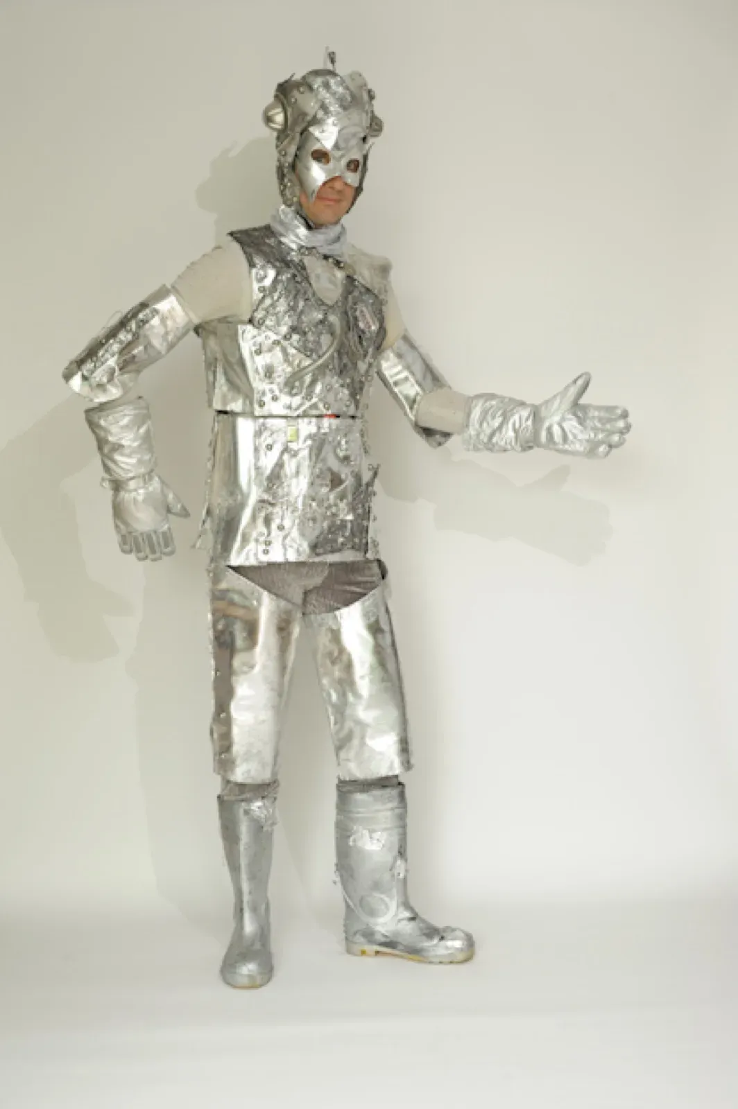 Mime performer in a silver robot costume