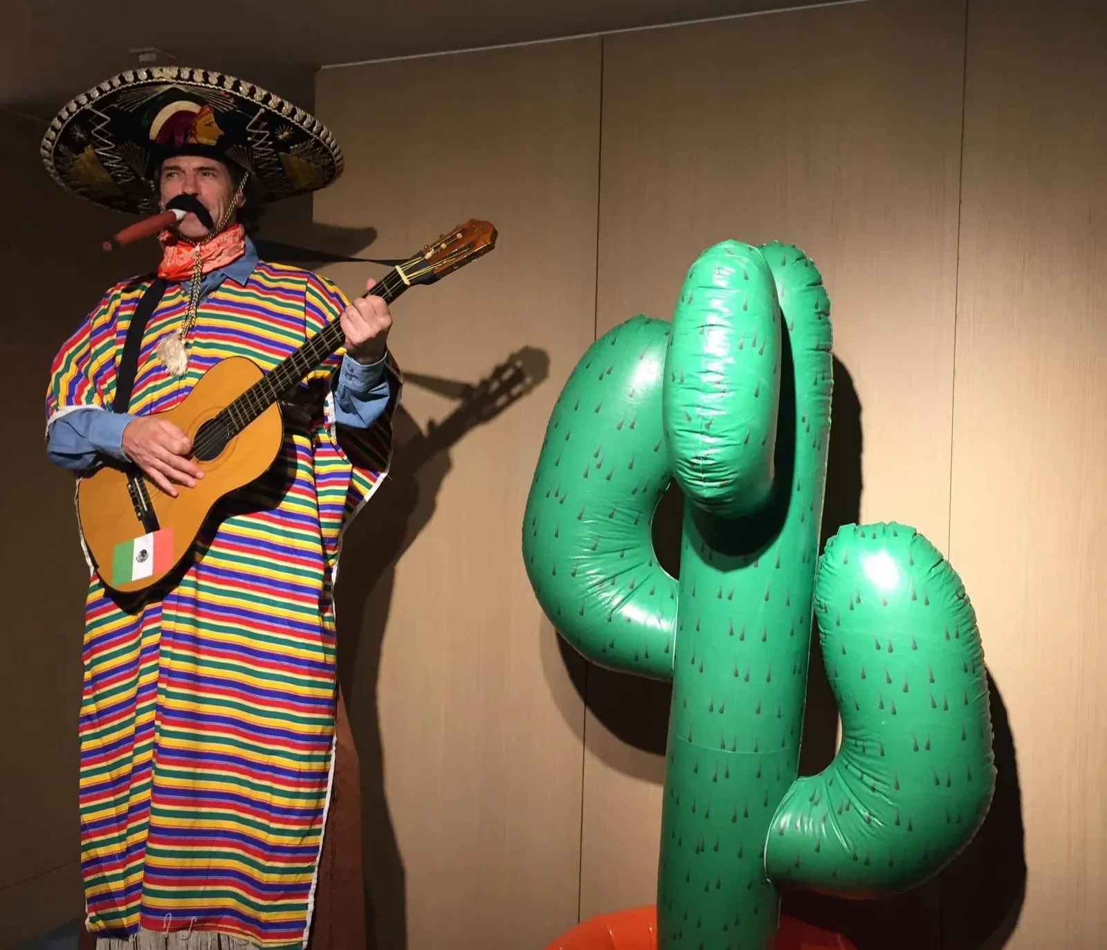 Hong Kong shopping mall entertainment with tall Mexican stilts walker musician