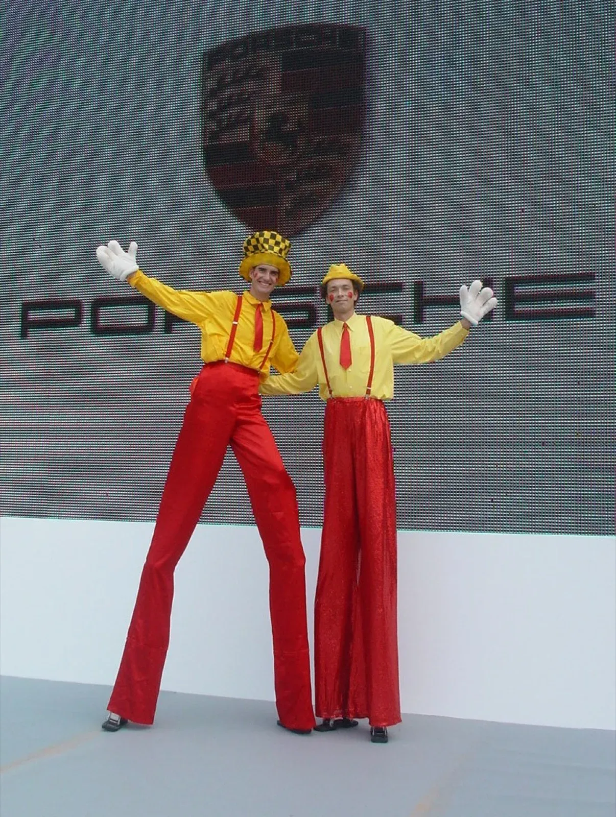 hong kong stilts walker clown duo in red & yellow for Porsche event