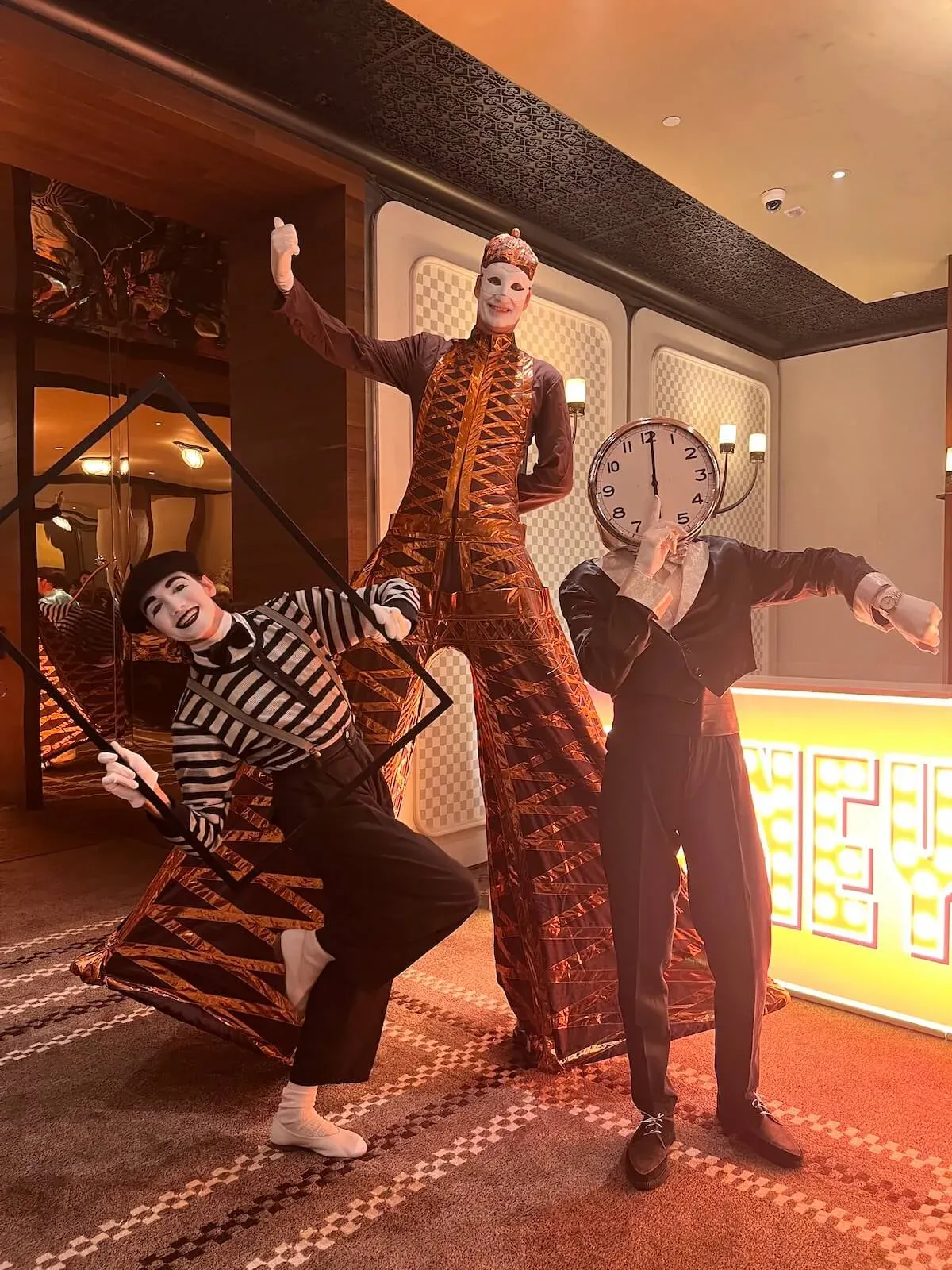 Stilts walker and costumed characters welcoming guests at a Hermès VIP anniversary party in Hong Kong