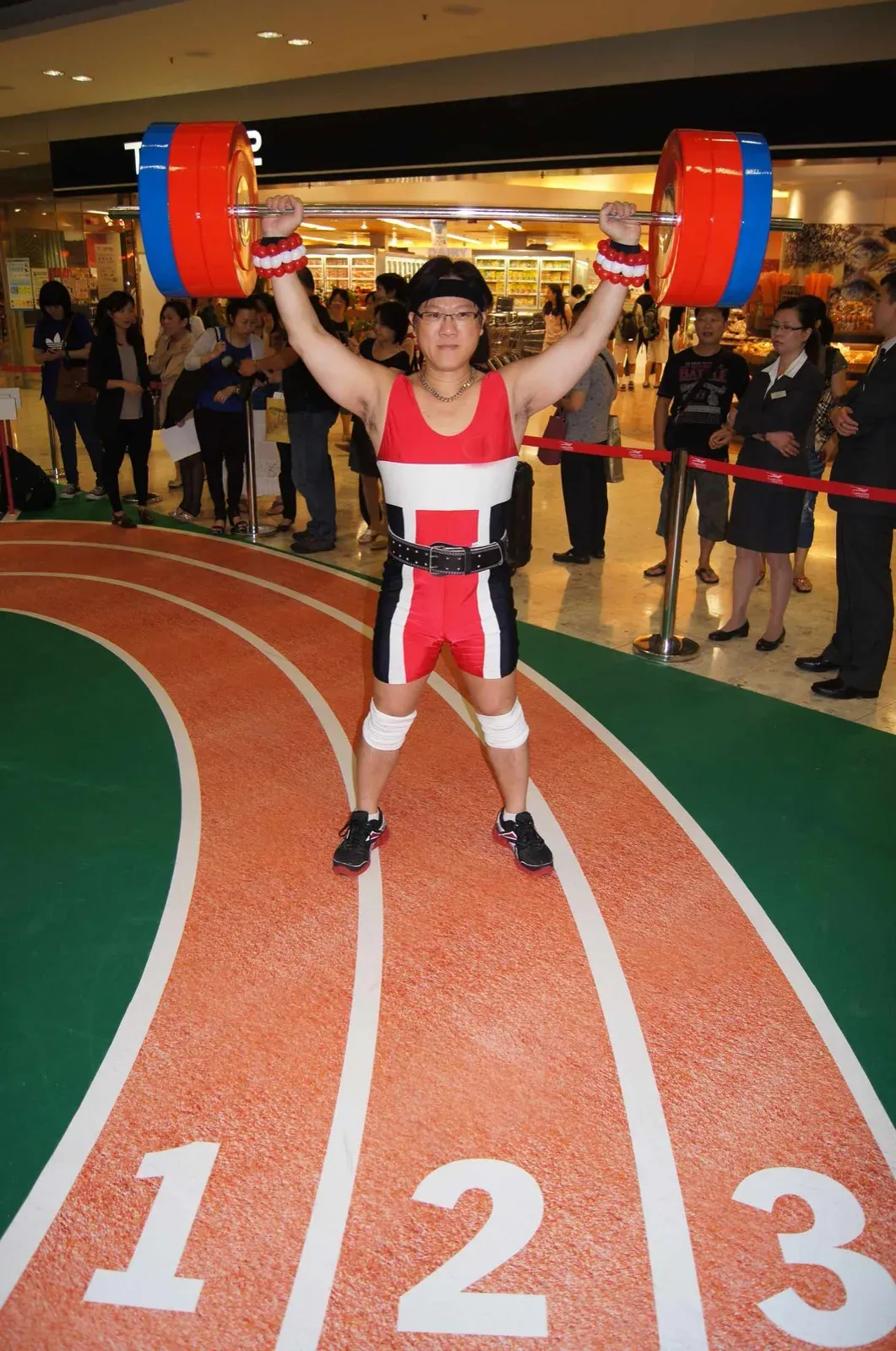 olympic weight lifting performer in Hong Kong promotion of Olympic games