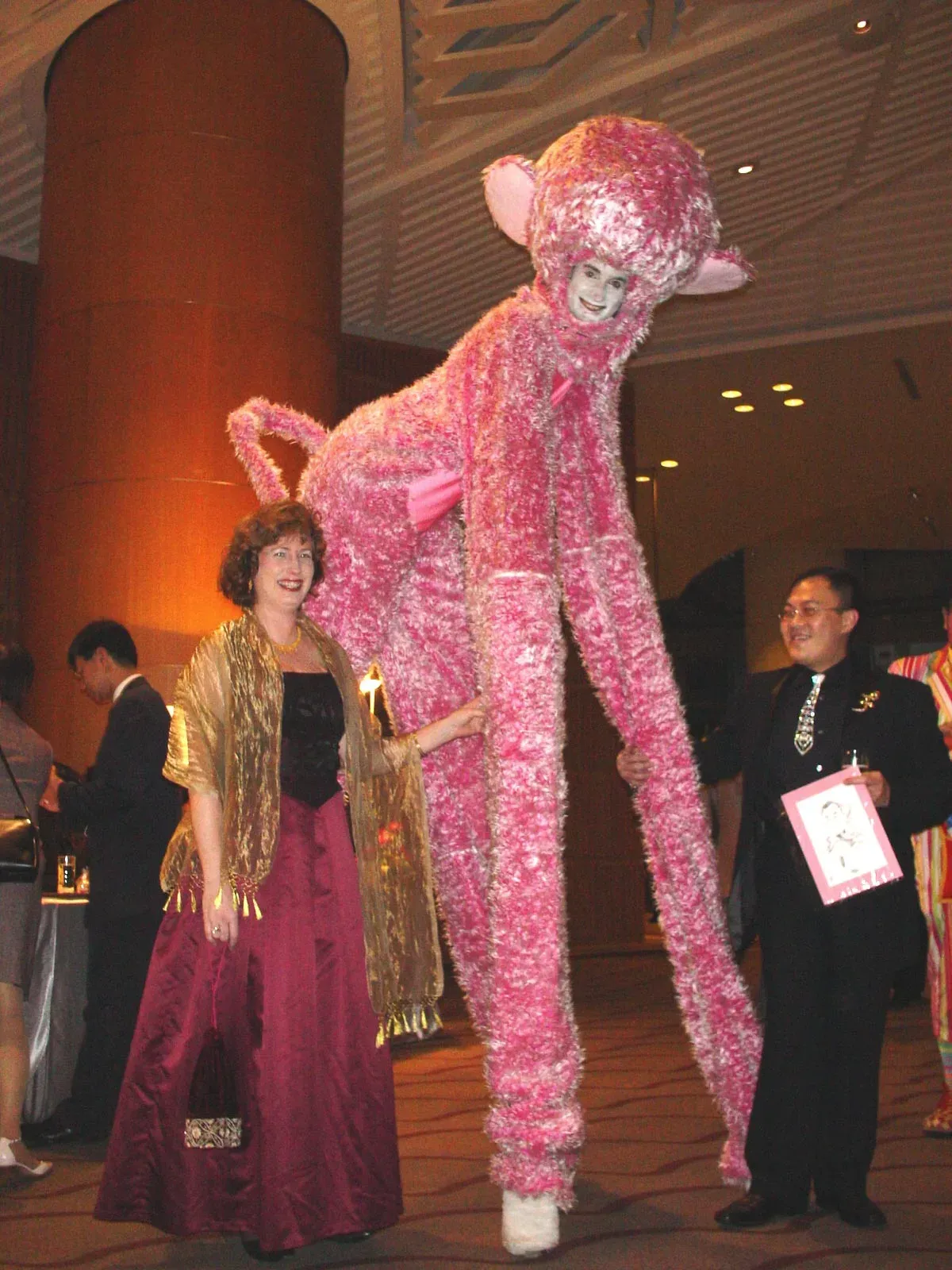 Pink fur animal on stilts perform in hong kong gala dinner