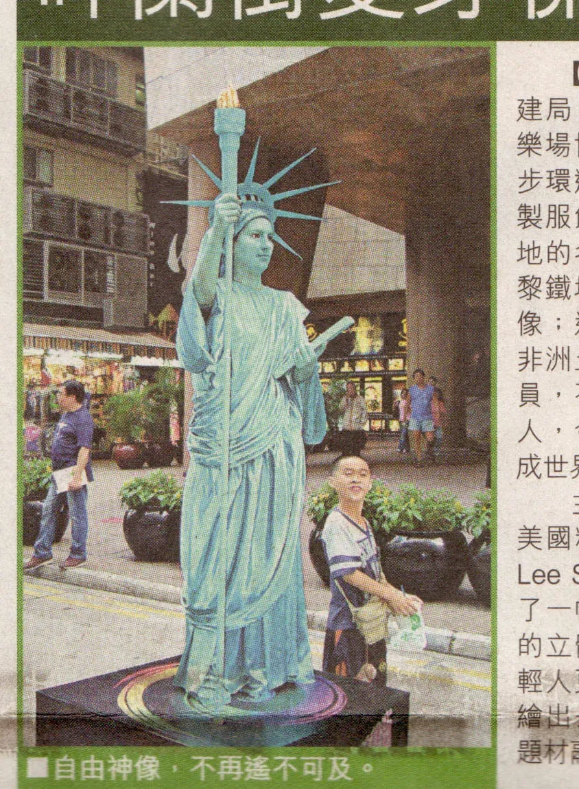 Statue of Liberty Mime in Hong Kong newspaper