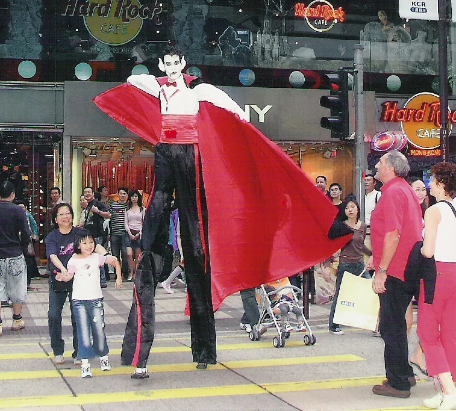 Vampire costume stilts walker in Hong Kong Street for Halloween