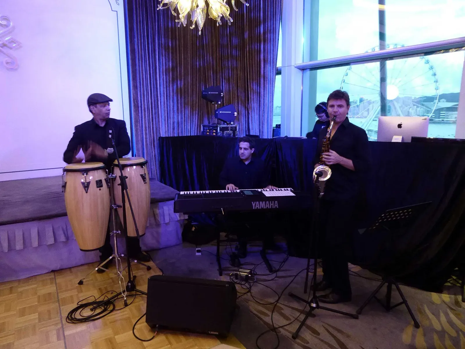 Live band with congas, keyboard and saxophone playing at a wedding party in Hong Kong
