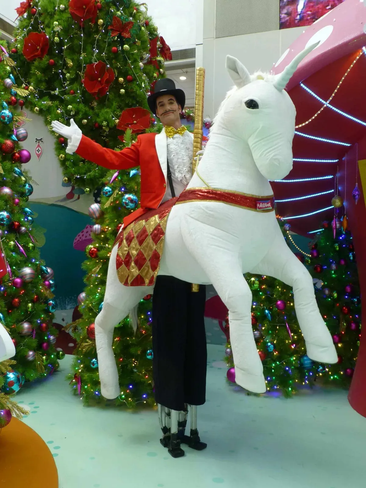 White horse on stilts performer during Hong Kong Christmas event in mall