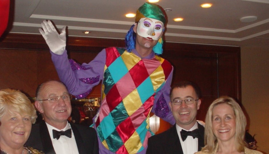 CIRCUS JESTER ON STILTS